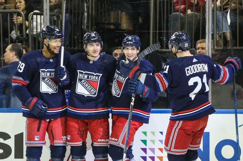 Feb 7, 2024; New York, New York, USA; New York Rangers left wing Jimmy Vesey (26) celebrates with his teammates after scoring a goal in the second period against the Tampa Bay Lightning at Madison Square Garden. Mandatory Credit: Wendell Cruz-USA TODAY Sports