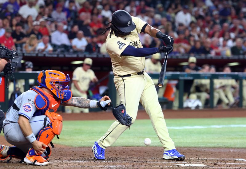 Aug 27, 2024; Phoenix, Arizona, USA; New York Mets catcher Francisco Alvarez (left) has his hand hit by the bat of Arizona Diamondbacks first baseman Josh Bell in the fourth inning at Chase Field. Mandatory Credit: Mark J. Rebilas-USA TODAY Sports