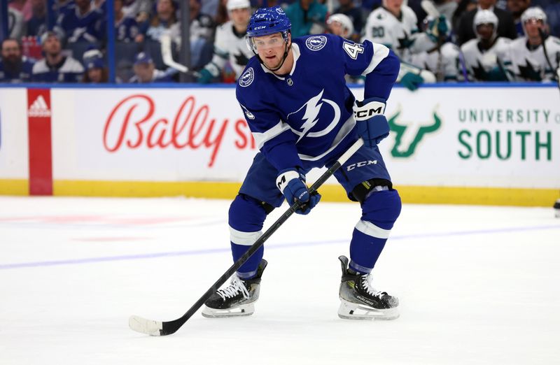 Oct 26, 2023; Tampa, Florida, USA; Tampa Bay Lightning defenseman Darren Raddysh (43) skates with the puck against the San Jose Sharks during the first period at Amalie Arena. Mandatory Credit: Kim Klement Neitzel-USA TODAY Sports