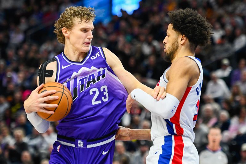 SALT LAKE CITY, UTAH - JANUARY 03: Lauri Markkanen #23 of the Utah Jazz drives against Cade Cunningham #2 of the Detroit Pistons during the first half of a game at Delta Center on January 03, 2024 in Salt Lake City, Utah. NOTE TO USER: User expressly acknowledges and agrees that, by downloading and or using this photograph, User is consenting to the terms and conditions of the Getty Images License Agreement. (Photo by Alex Goodlett/Getty Images)