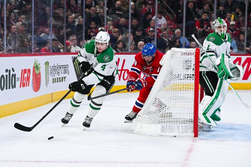 Nov 13, 2025; Montreal, Quebec, CAN; Dallas Stars defenseman Miro Heiskanen (4) defends the puck against Montreal Canadiens center Nick Suzuki (14) behind the net during the second period at Bell Centre. Mandatory Credit: David Kirouac-Imagn Images