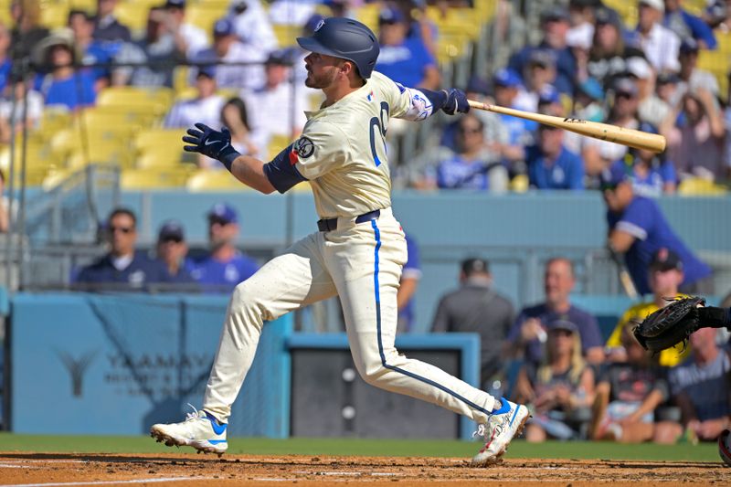 Jul 20, 2024; Los Angeles, California, USA;  Los Angeles Dodgers second baseman Gavin Lux (9) hits a solo home run in the second inning against the Boston Red Sox at Dodger Stadium. Mandatory Credit: Jayne Kamin-Oncea-USA TODAY Sports