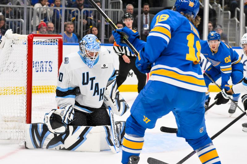 Oct 23, 2025; St. Louis, Missouri, USA; Utah Mammoth goaltender Karel Vejmelka (70) defends the net against a shot by St. Louis Blues center Robert Thomas (18) during the second period at Enterprise Center. Mandatory Credit: Jeff Curry-Imagn Images