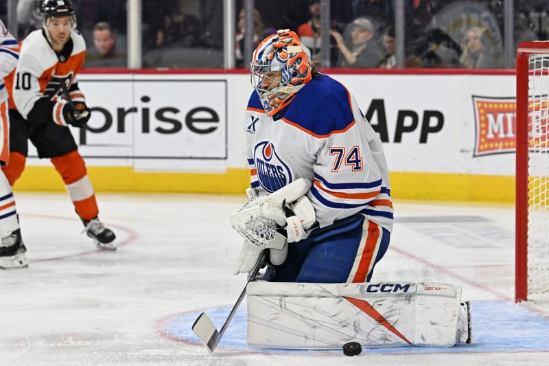 Nov 12, 2025; Philadelphia, Pennsylvania, USA; Edmonton Oilers goaltender Stuart Skinner (74) makes a save against the Philadelphia Flyers during the first period at Xfinity Mobile Arena. Mandatory Credit: Eric Hartline-Imagn Images