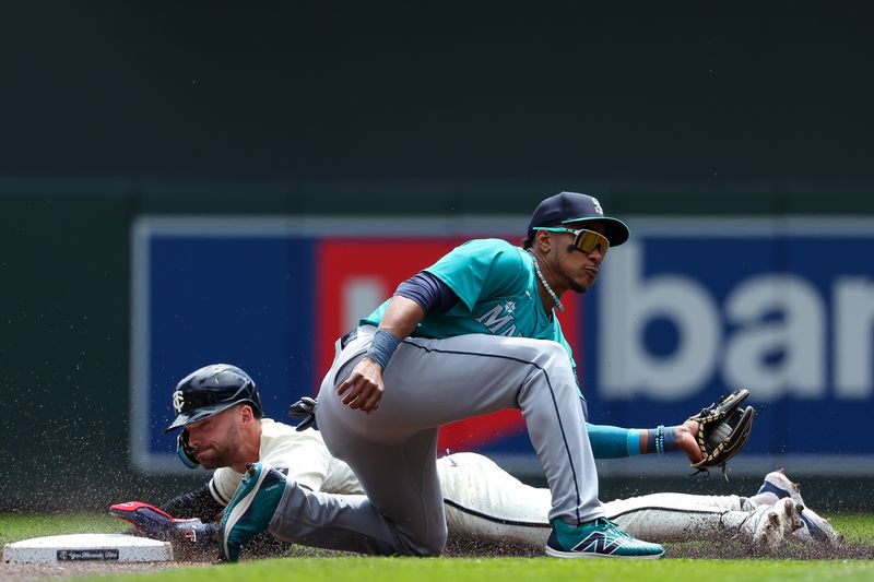 May 9, 2024; Minneapolis, Minnesota, USA; Minnesota Twins Edouard Julien (47) steals second base as Seattle Mariners second baseman Jorge Polanco (7) fields the ball during the first inning at Target Field. Mandatory Credit: Matt Krohn-USA TODAY Sports