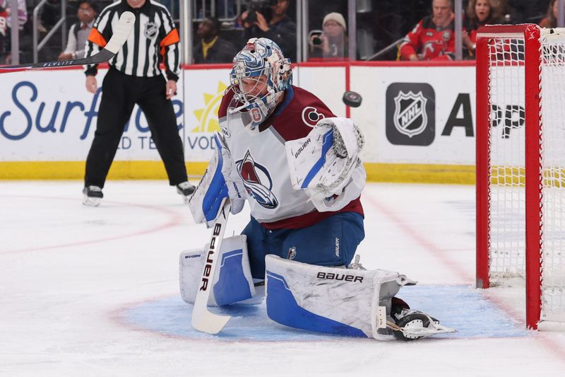 Oct 26, 2025; Newark, New Jersey, USA; Colorado Avalanche goaltender Trent Miner (50) defends his net against the New Jersey Devils during the second period at Prudential Center. Mandatory Credit: Ed Mulholland-Imagn Images