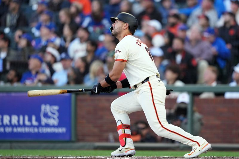 Jun 26, 2024; San Francisco, California, USA; San Francisco Giants left fielder Michael Conforto (8) hits a home run against the Chicago Cubs during the second inning at Oracle Park. Mandatory Credit: Darren Yamashita-USA TODAY Sports