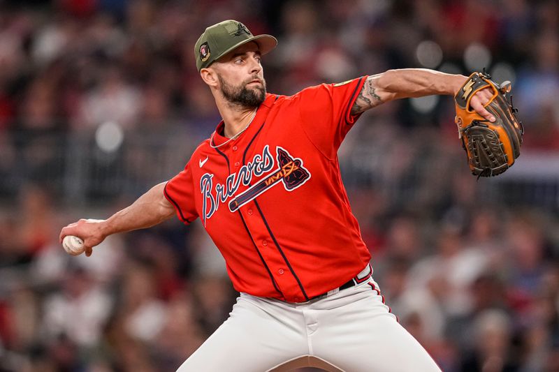 May 19, 2023; Cumberland, Georgia, USA; Atlanta Braves relief pitcher Nick Anderson (61) pitches against the Seattle Mariners during the eighth inning at Truist Park. Mandatory Credit: Dale Zanine-USA TODAY Sports