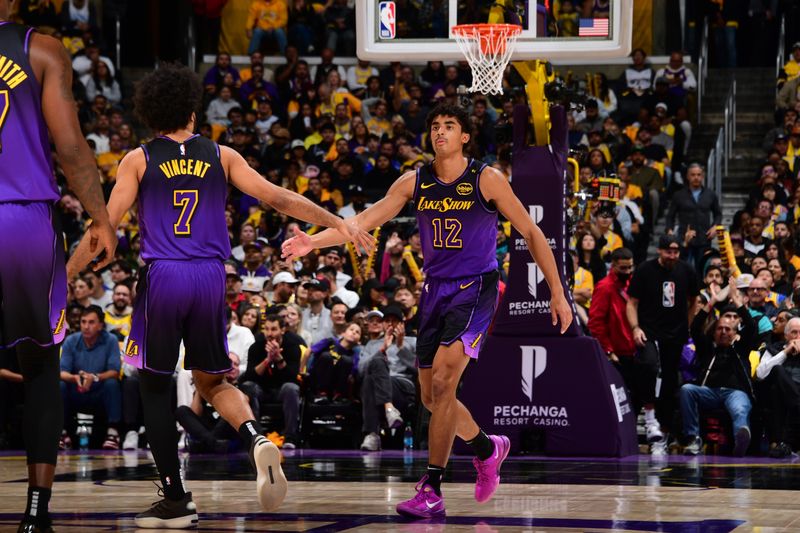 LOS ANGELES, CA - JANUARY 13: Max Christie #12 and Gabe Vincent #7 of the Los Angeles Lakers high five during the game against the San Antonio Spurs on January 13, 2025 at Crypto.Com Arena in Los Angeles, California. NOTE TO USER: User expressly acknowledges and agrees that, by downloading and/or using this Photograph, user is consenting to the terms and conditions of the Getty Images License Agreement. Mandatory Copyright Notice: Copyright 2025 NBAE (Photo by Adam Pantozzi/NBAE via Getty Images)