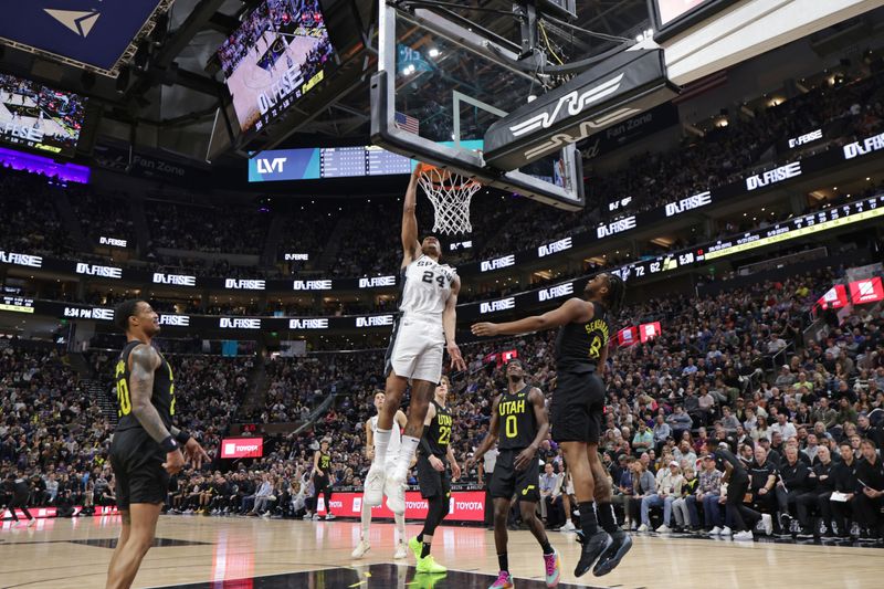 SALT LAKE CITY, UT - MARCH 27: Devin Vassell #24 of the San Antonio Spurs dunks the ball during the game against the Utah Jazz on March 27, 2024 at Delta Center in Salt Lake City, Utah. NOTE TO USER: User expressly acknowledges and agrees that, by downloading and or using this Photograph, User is consenting to the terms and conditions of the Getty Images License Agreement. Mandatory Copyright Notice: Copyright 2024 NBAE (Photo by Chris Nicoll/NBAE via Getty Images)