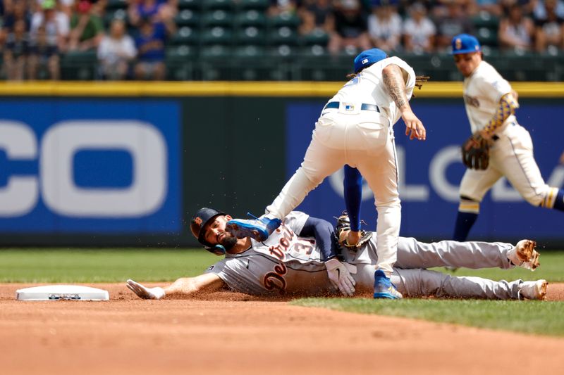 Jul 16, 2023; Seattle, Washington, USA; Seattle Mariners shortstop J.P. Crawford (3) tags out Detroit Tigers designated hitter Riley Greene (31) on a stolen base attempt during the first inning at T-Mobile Park. Mandatory Credit: Joe Nicholson-USA TODAY Sports