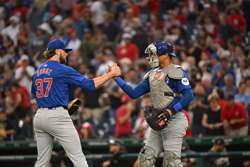 Aug 31, 2024; Washington, District of Columbia, USA; Chicago Cubs relief pitcher Porter Hodge (37) and catcher Christian Bethancourt (60) celebrate after defeating the Washington Nationals at Nationals Park. Mandatory Credit: Rafael Suanes-USA TODAY Sports