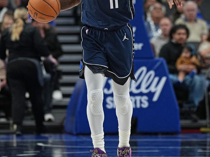 DALLAS, TX - FEBRUARY 10: Kyrie Irving #11 of the Dallas Mavericks brings the ball up court during the game against the Oklahoma City Thunder on February 10, 2024 at the American Airlines Center in Dallas, Texas. NOTE TO USER: User expressly acknowledges and agrees that, by downloading and or using this photograph, User is consenting to the terms and conditions of the Getty Images License Agreement. Mandatory Copyright Notice: Copyright 2024 NBAE (Photo by Glenn James/NBAE via Getty Images)