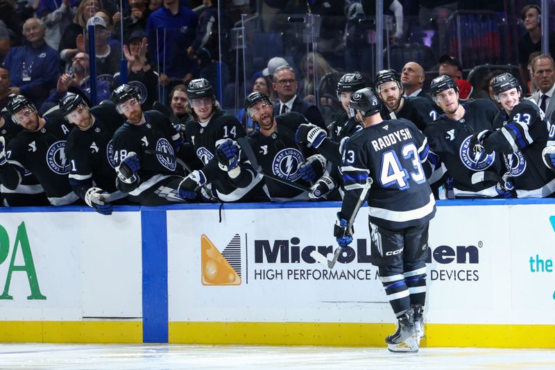 Nov 16, 2024; Tampa, Florida, USA; Tampa Bay Lightning defenseman Darren Raddysh (43) celebrates after scoring a goal against the New Jersey Devils in the third period at Amalie Arena. Mandatory Credit: Nathan Ray Seebeck-Imagn Images