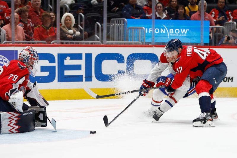 Oct 31, 2024; Washington, District of Columbia, USA; Montreal Canadiens left wing Emil Heineman (51) attempts a shot on Washington Capitals goaltender Charlie Lindgren (79) as Capitals defenseman Martin Fehervary (42) defends in the second period at Capital One Arena. Mandatory Credit: Geoff Burke-Imagn Images