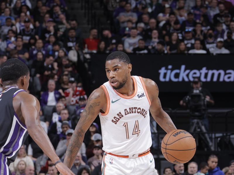 SACRAMENTO, CA - FEBRUARY 22: Blake Wesley #14 of the San Antonio Spurs handles the ball during the game against the Sacramento Kings on February 22, 2024 at Golden 1 Center in Sacramento, California. NOTE TO USER: User expressly acknowledges and agrees that, by downloading and or using this Photograph, user is consenting to the terms and conditions of the Getty Images License Agreement. Mandatory Copyright Notice: Copyright 2023 NBAE (Photo by Rocky Widner/NBAE via Getty Images)