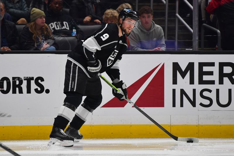 Dec 30, 2023; Los Angeles, California, USA; Los Angeles Kings right wing Adrian Kempe (9) controls the puck against the Edmonton Oilers during the second period at Crypto.com Arena. Mandatory Credit: Gary A. Vasquez-USA TODAY Sports