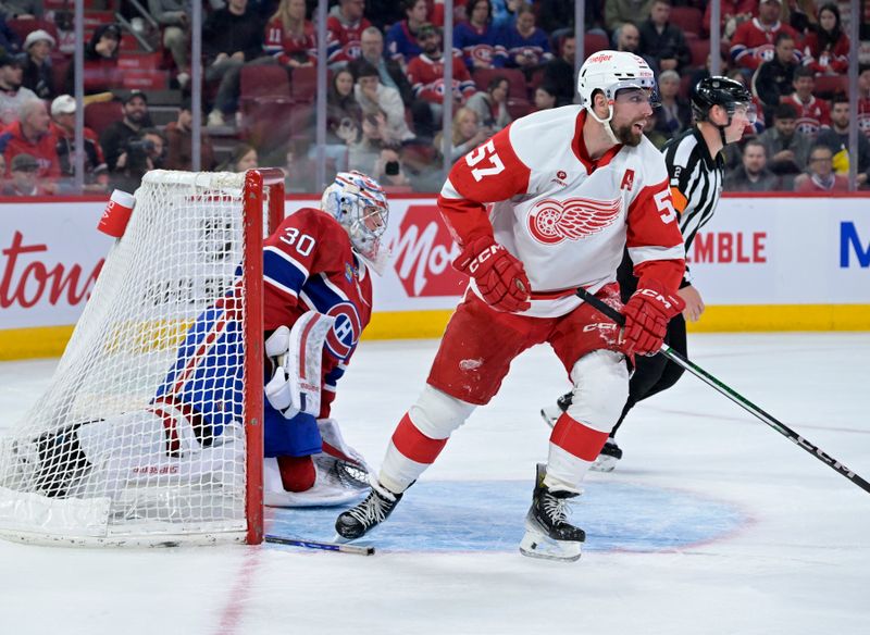 Apr 16, 2024; Montreal, Quebec, CAN; Detroit Red Wings forward David Perron (57) and Montreal Canadiens goalie Cayden Primeau (30) during the third period at the Bell Centre. Mandatory Credit: Eric Bolte-USA TODAY Sports