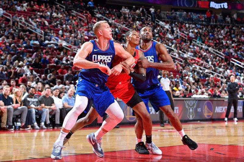 HOUSTON, TX - MARCH 6: Mason Plumlee #44 and Kawhi Leonard #2 of the LA Clippers box out during the game against the Houston Rockets on March 6, 2024 at the Toyota Center in Houston, Texas. NOTE TO USER: User expressly acknowledges and agrees that, by downloading and or using this photograph, User is consenting to the terms and conditions of the Getty Images License Agreement. Mandatory Copyright Notice: Copyright 2024 NBAE (Photo by Logan Riely/NBAE via Getty Images)