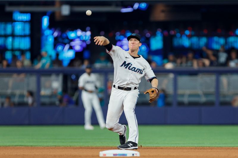 Jun 4, 2023; Miami, Florida, USA; Miami Marlins shortstop Joey Wendle (18) catches a ground ball during the seventh inning against the Oakland Athletics at loanDepot Park. Mandatory Credit: Sam Navarro-USA TODAY Sports