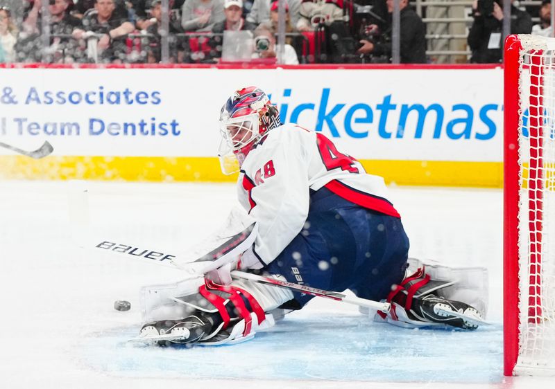 May 10, 2025; Raleigh, North Carolina, USA; IWashington Capitals goaltender Logan Thompson (48) stops the shot against the Carolina Hurricanes during the first period n game three of the second round of the 2025 Stanley Cup Playoffs at Lenovo Center. Mandatory Credit: James Guillory-Imagn Images