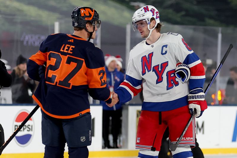 Feb 18, 2024; East Rutherford, New Jersey, USA; New York Islanders left wing Anders Lee (27) and New York Rangers defenseman Jacob Trouba (8) shake hands after the Rangers defeated the Islanders in overtime in a Stadium Series ice hockey game at MetLife Stadium. Mandatory Credit: Brad Penner-USA TODAY Sports