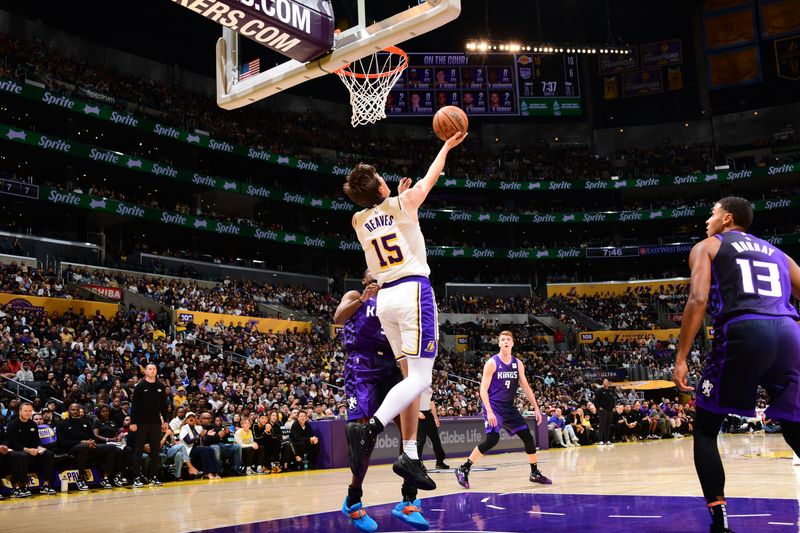 LOS ANGELES, CA - OCTOBER 26: Austin Reaves #15 of the Los Angeles Lakers drives to the basket during the game against the Sacramento Kings on October 26, 2024 at Crypto.Com Arena in Los Angeles, California. NOTE TO USER: User expressly acknowledges and agrees that, by downloading and/or using this Photograph, user is consenting to the terms and conditions of the Getty Images License Agreement. Mandatory Copyright Notice: Copyright 2024 NBAE (Photo by Adam Pantozzi/NBAE via Getty Images)