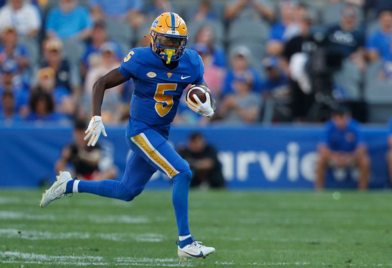 Sep 21, 2024; Pittsburgh, Pennsylvania, USA; Pittsburgh Panthers wide receiver Raphael Williams (5) runs after a pass reception against the Youngstown State Penguins during the second quarter at Acrisure Stadium. Mandatory Credit: Charles LeClaire-Imagn Images