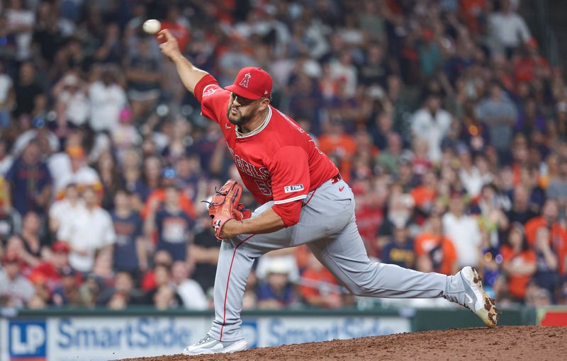 May 21, 2024; Houston, Texas, USA; Los Angeles Angels relief pitcher Carlos Estevez (53) delivers a pitch during the tenth inning against the Houston Astros at Minute Maid Park. Mandatory Credit: Troy Taormina-USA TODAY Sports