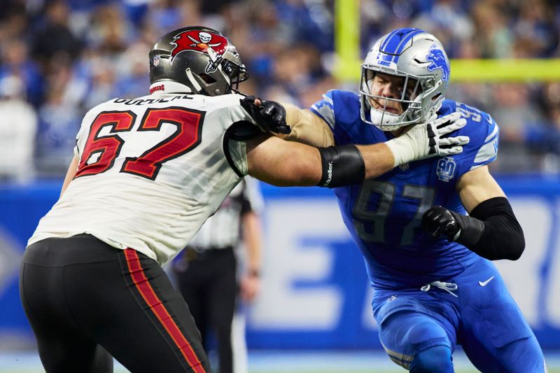 Tampa Bay Buccaneers offensive tackle Luke Goedeke (67) blocks Detroit Lions defensive end Aidan Hutchinson (97) during an NFL divisional round playoff football game, Sunday, Jan. 21, 2024, in Detroit. (AP Photo/Rick Osentoski)