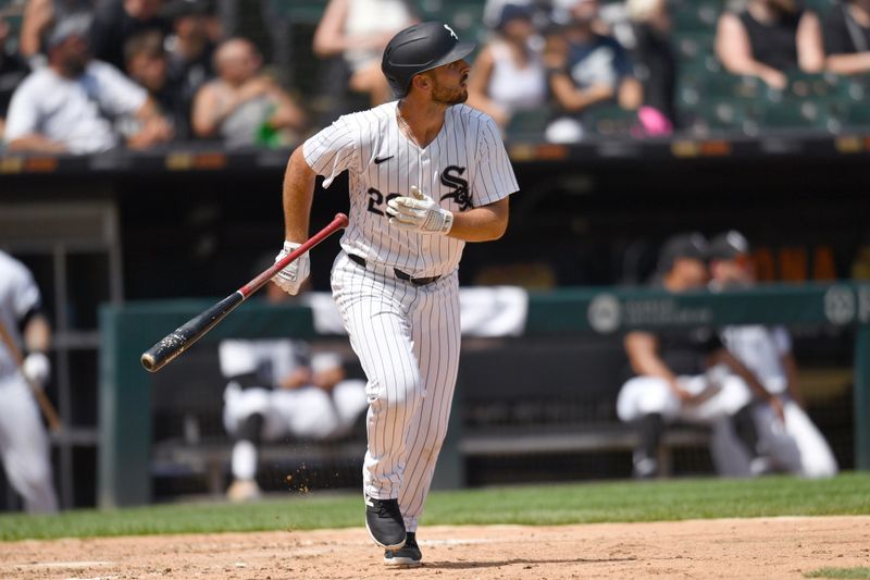 Jun 29, 2024; Chicago, Illinois, USA; Chicago White Sox shortstop Paul DeJong (29) hits a two-run home run during the sixth inning against the Colorado Rockies at Guaranteed Rate Field. Mandatory Credit: Patrick Gorski-USA TODAY Sports