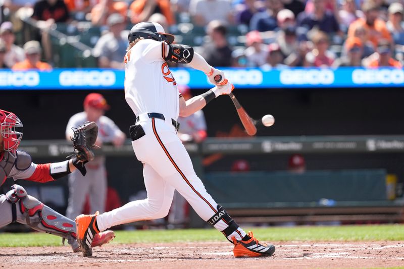 May 26, 2025; Baltimore, Maryland, USA; Baltimore Orioles second baseman Jackson Holliday (7) hits an RBI single against the St. Louis Cardinals during the third inning at Oriole Park at Camden Yards. Mandatory Credit: Gregory Fisher-Imagn Images