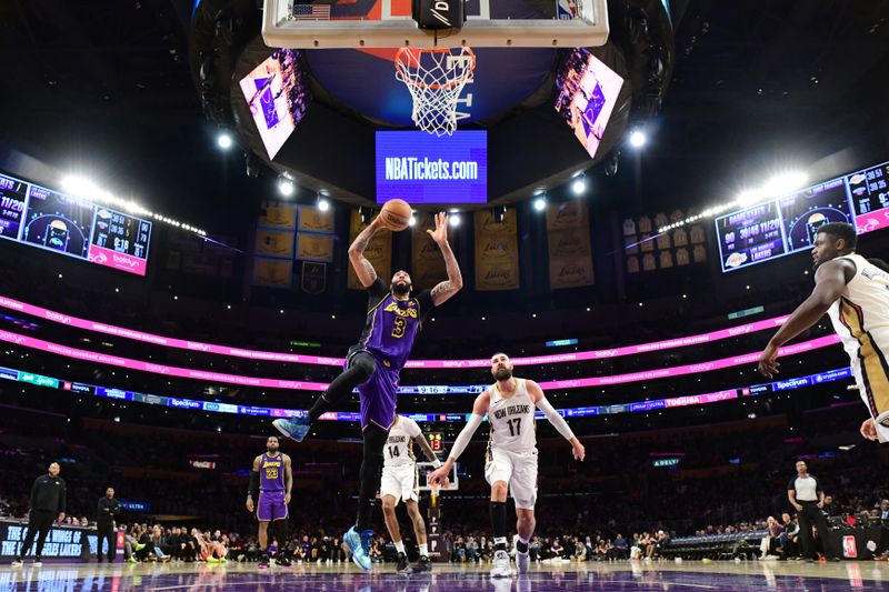 LOS ANGELES, CA - FEBRUARY 9:  Anthony Davis #3 of the Los Angeles Lakers drives to the basket during the game against the New Orleans Pelicans on February 9, 2024 at Crypto.Com Arena in Los Angeles, California. NOTE TO USER: User expressly acknowledges and agrees that, by downloading and/or using this Photograph, user is consenting to the terms and conditions of the Getty Images License Agreement. Mandatory Copyright Notice: Copyright 2024 NBAE (Photo by Adam Pantozzi/NBAE via Getty Images)