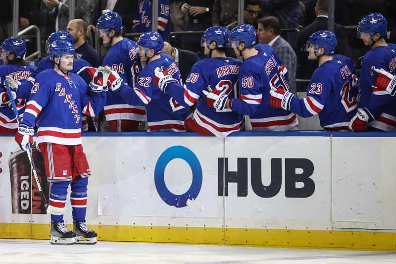 Nov 1, 2024; New York, New York, USA;  New York Rangers left wing Alexis Lafrenière (13) celebrates with his teammates after scoring a goal in the third period against the Ottawa Senators at Madison Square Garden. Mandatory Credit: Wendell Cruz-Imagn Images