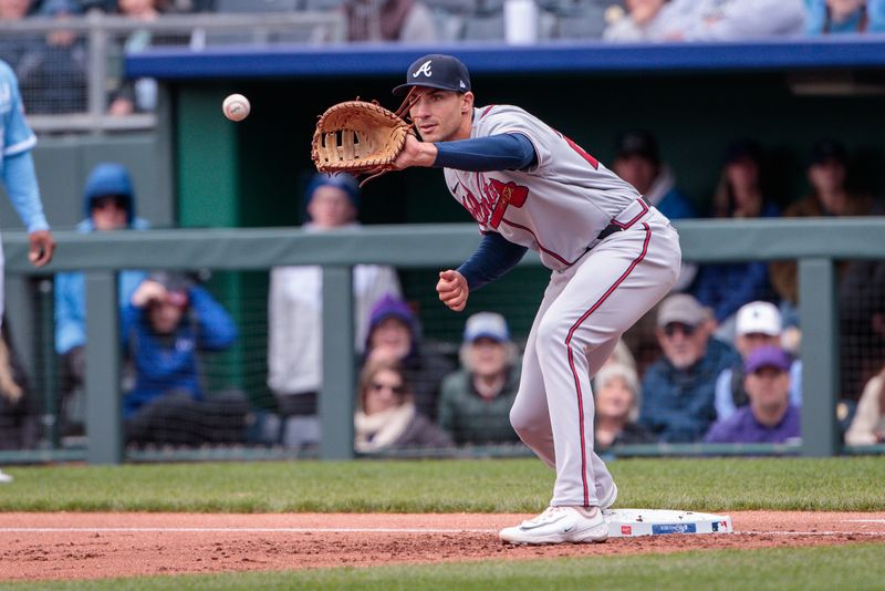 Apr 16, 2023; Kansas City, Missouri, USA; Atlanta Braves first baseman Matt Olson (28) reaches for a throw during the first inning against the Kansas City Royals at Kauffman Stadium. Mandatory Credit: William Purnell-USA TODAY Sports