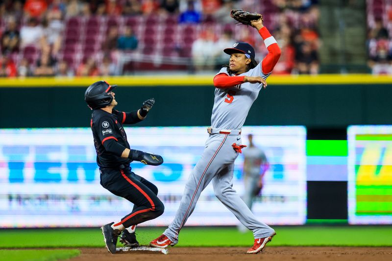 May 2, 2025; Cincinnati, Ohio, USA; Washington Nationals shortstop CJ Abrams (5) tags Cincinnati Reds outfielder TJ Friedl (29) out at second in the second inning at Great American Ball Park. Mandatory Credit: Katie Stratman-Imagn Images
