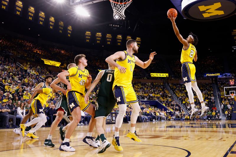 Feb 18, 2023; Ann Arbor, Michigan, USA;  Michigan Wolverines guard Kobe Bufkin (2) grabs a rebound against the Michigan State Spartans in the second half at Crisler Center. Mandatory Credit: Rick Osentoski-USA TODAY Sports