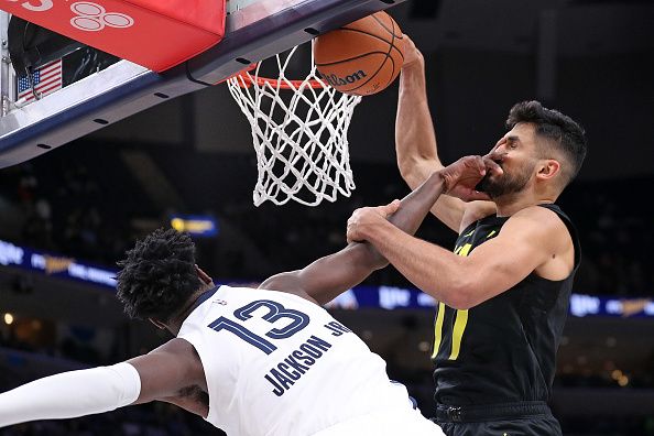 MEMPHIS, TENNESSEE - NOVEMBER 29: Omer Yurtseven #77 of the Utah Jazz goes to the basket against Jaren Jackson Jr. #13 of the Memphis Grizzlies during the second half at FedExForum on November 29, 2023 in Memphis, Tennessee. NOTE TO USER: User expressly acknowledges and agrees that, by downloading and or using this photograph, User is consenting to the terms and conditions of the Getty Images License Agreement.  (Photo by Justin Ford/Getty Images)