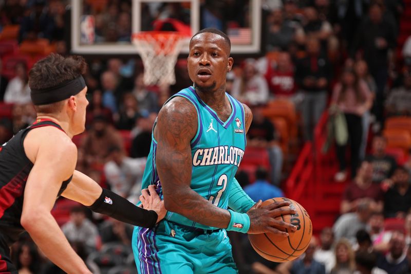 MIAMI, FL - JANUARY 14: Terry Rozier #3 of the Charlotte Hornets looks on during the game against the Miami Heat on January 14, 2024 at Kaseya Center in Miami, Florida. NOTE TO USER: User expressly acknowledges and agrees that, by downloading and or using this Photograph, user is consenting to the terms and conditions of the Getty Images License Agreement. Mandatory Copyright Notice: Copyright 2024 NBAE (Photo by Issac Baldizon/NBAE via Getty Images)