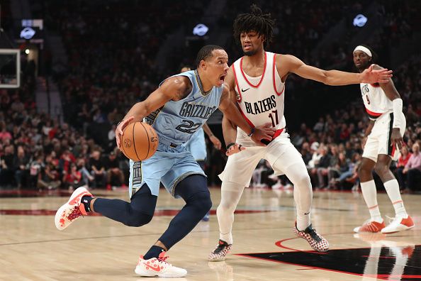 PORTLAND, OREGON - NOVEMBER 05: Desmond Bane #22 of the Memphis Grizzlies drives past Shaedon Sharpe #17 of the Portland Trail Blazers during the first quarter at Moda Center on November 05, 2023 in Portland, Oregon. NOTE TO USER: User expressly acknowledges and agrees that, by downloading and or using this photograph, User is consenting to the terms and conditions of the Getty Images License Agreement.? (Photo by Amanda Loman/Getty Images)