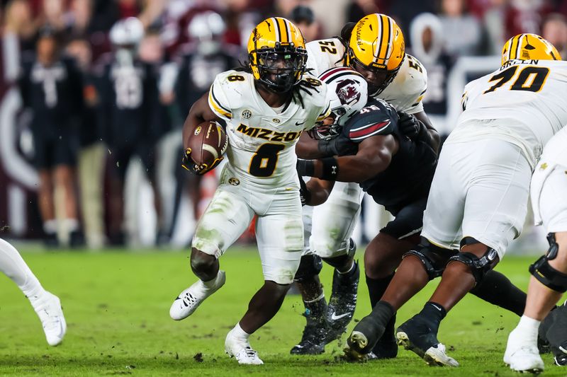 Nov 16, 2024; Columbia, South Carolina, USA; Missouri Tigers running back Nate Noel (8) rushes against the South Carolina Gamecocks in the second half at Williams-Brice Stadium. Mandatory Credit: Jeff Blake-Imagn Images