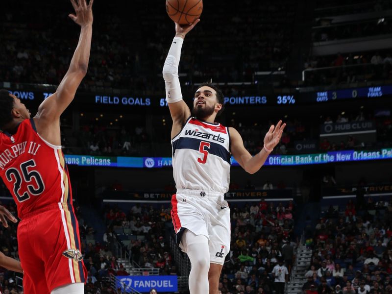 NEW ORLEANS, LA - FEBRUARY 14: Tyus Jones #5 of the Washington Wizards drives to the basket during the game against the New Orleans Pelicans on February 14, 2024 at the Smoothie King Center in New Orleans, Louisiana. NOTE TO USER: User expressly acknowledges and agrees that, by downloading and or using this Photograph, user is consenting to the terms and conditions of the Getty Images License Agreement. Mandatory Copyright Notice: Copyright 2024 NBAE (Photo by Layne Murdoch Jr./NBAE via Getty Images)