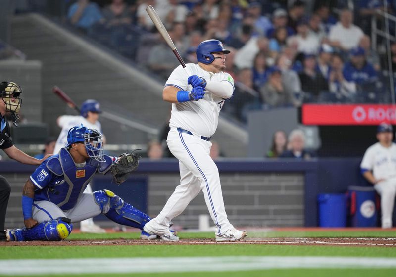 May 1, 2024; Toronto, Ontario, CAN; Toronto Blue Jays designated hitter Daniel Vogelbach (20) gets on base on a fielders choice against the Kansas City Royals during the fourth inning at Rogers Centre. Mandatory Credit: Nick Turchiaro-USA TODAY Sports