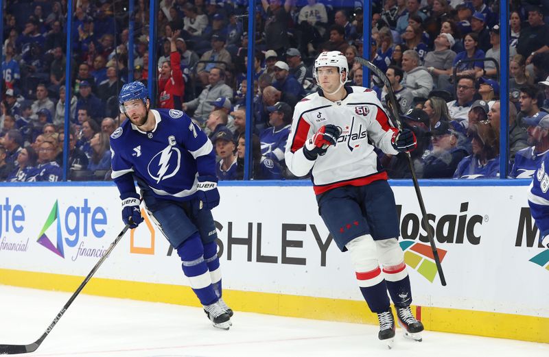 Nov 27, 2024; Tampa, Florida, USA;Washington Capitals center Aliaksei Protas (21) celebrates after he scores against the Tampa Bay Lightning during the second period at Amalie Arena. Mandatory Credit: Kim Klement Neitzel-Imagn Images