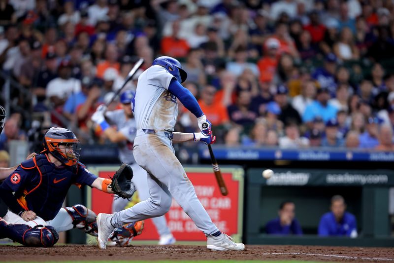 Jul 28, 2024; Houston, Texas, USA; Los Angeles Dodgers outfielder James Outman (33) hits a home run to left field against the Houston Astros during the fifth inning at Minute Maid Park. Mandatory Credit: Erik Williams-USA TODAY Sports