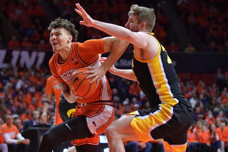 Feb 24, 2024; Champaign, Illinois, USA;  Illinois Fighting Illini forward Coleman Hawkins (33) drives past Iowa Hawkeyes forward Ben Krikke (23) during the first half at State Farm Center. Mandatory Credit: Ron Johnson-USA TODAY Sports