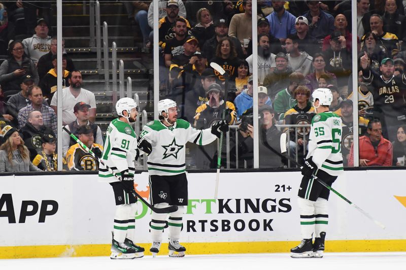 Oct 24, 2024; Boston, Massachusetts, USA;  Dallas Stars center Matt Duchene (95) reacts with center Tyler Seguin (91) and defenseman Thomas Harley (55) after scoring a goal during the first period against the Boston Bruins at TD Garden. Mandatory Credit: Bob DeChiara-Imagn Images