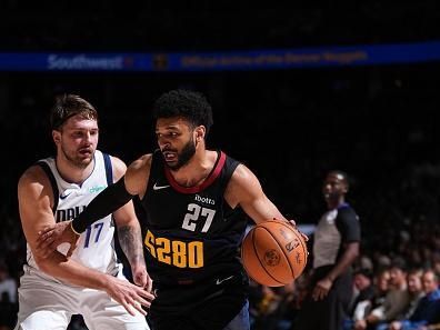 DENVER, CO - DECEMBER 18: Jamal Murray #27 of the Denver Nuggets drives to the basket during the game against the Dallas Mavericks on December 18, 2023 at the Ball Arena in Denver, Colorado. NOTE TO USER: User expressly acknowledges and agrees that, by downloading and/or using this Photograph, user is consenting to the terms and conditions of the Getty Images License Agreement. Mandatory Copyright Notice: Copyright 2023 NBAE (Photo by Garrett Ellwood/NBAE via Getty Images)