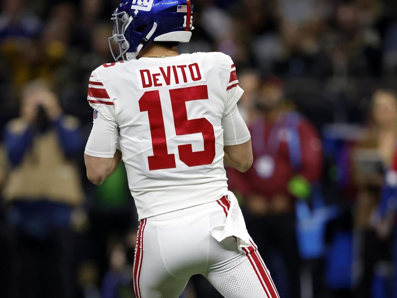 New York Giants quarterback Tommy DeVito (15) seen from behind during an NFL football game against the New Orleans Saints, Sunday, Dec. 17, 2023, in New Orleans. (AP Photo/Tyler Kaufman)