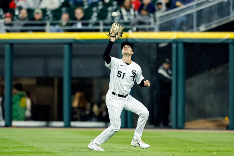 Apr 28, 2023; Chicago, Illinois, USA; Chicago White Sox right fielder Adam Haseley (51) catches a fly ball hit by Tampa Bay Rays center fielder Manuel Margot (not pictured) during the ninth inning at Guaranteed Rate Field. Mandatory Credit: Kamil Krzaczynski-USA TODAY Sports